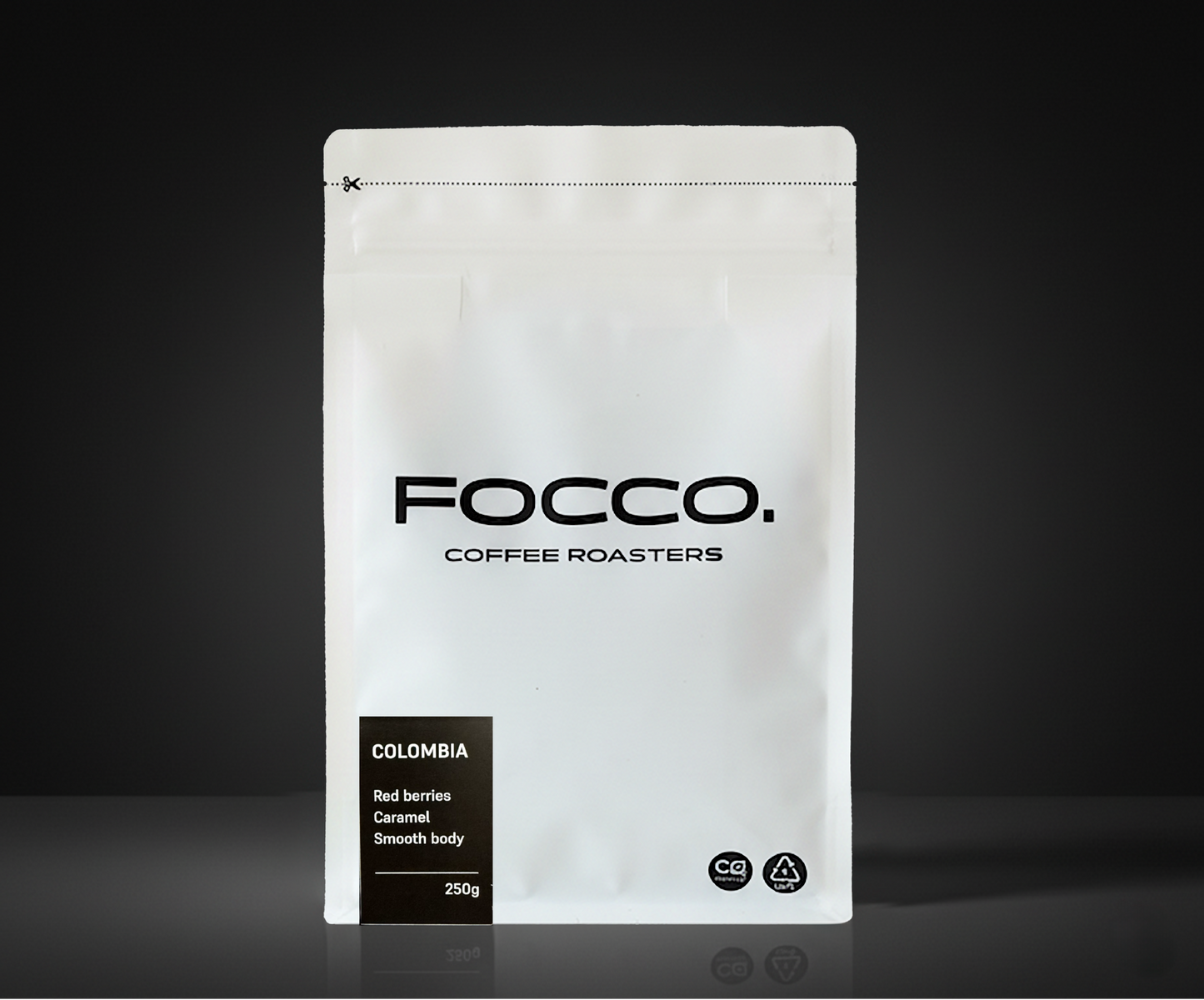 White coffee bag with 'FOCCO Coffee Roasters' branding on a black background