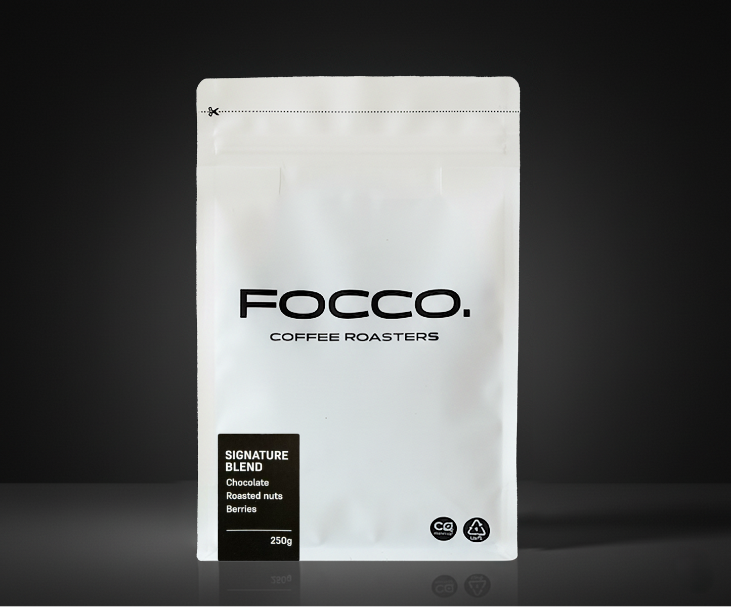 White coffee bag with 'FOCCO Coffee Roasters' branding on a black background