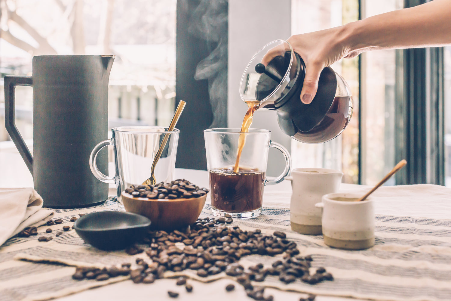 brewing coffee on a table with coffee beans