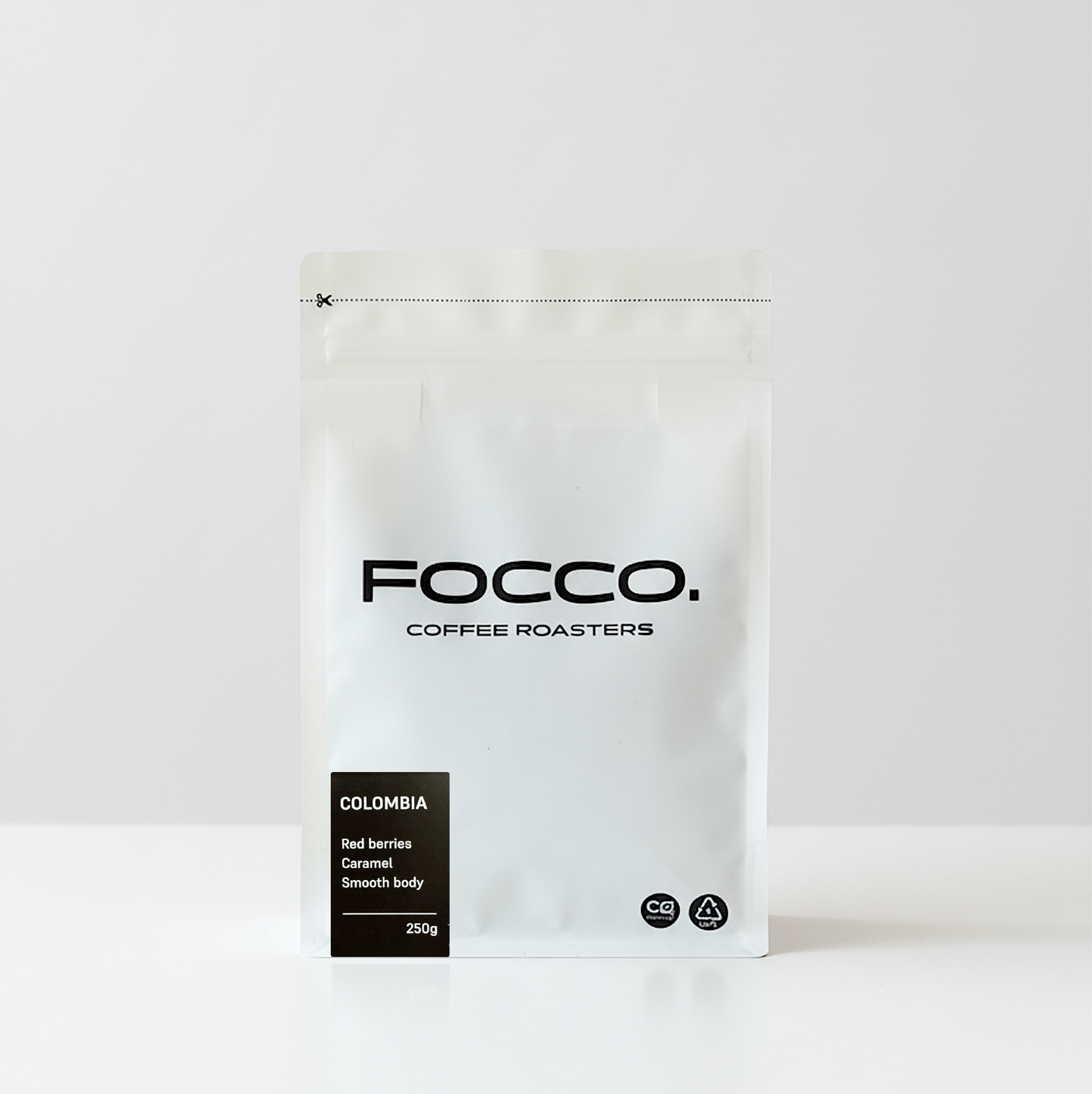 White coffee bag with 'FOCCO Coffee Roasters' branding on a white background and Colombia black label