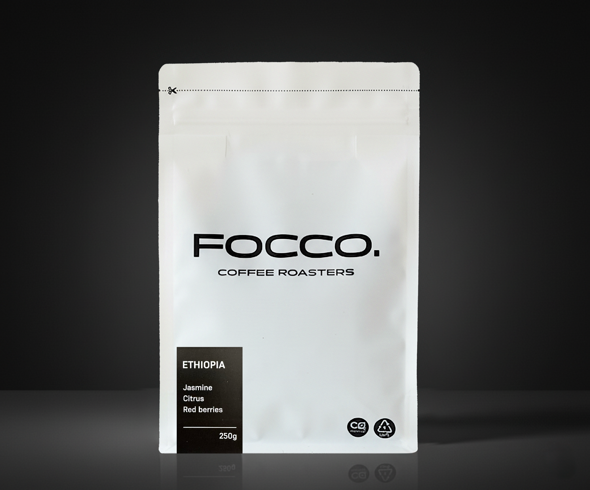 White coffee bag with 'FOCCO Coffee Roasters' branding on a black background
