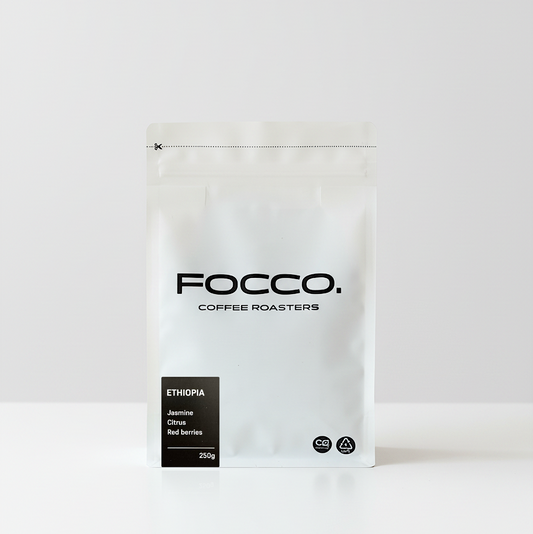 White coffee bag with 'FOCCO Coffee Roasters' branding on a white background and Ethiopia black label