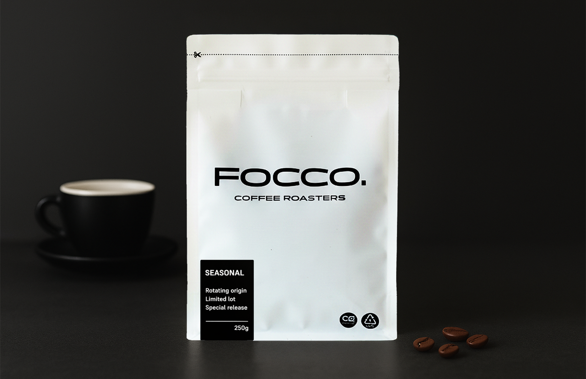 Focco Coffee Roasters packaging with a black cup and coffee beans on a dark background